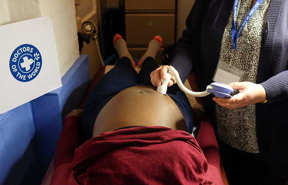 A pregnant woman is examined at Doctors of the World's family clinic. 
